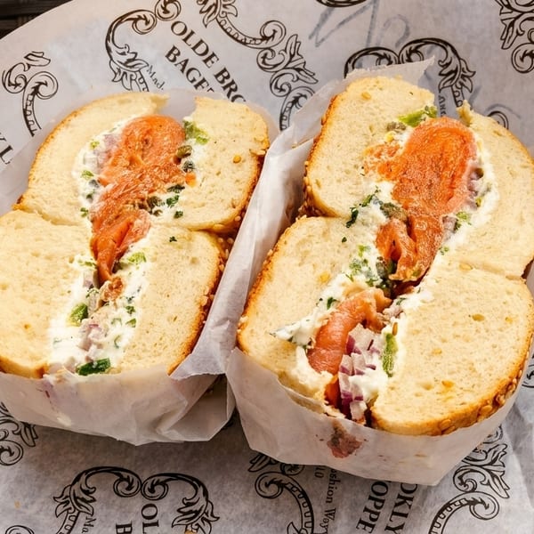 Two Olde Brooklyn Bagel Shoppe bagels with lox, cream cheese, capers, and red onion.